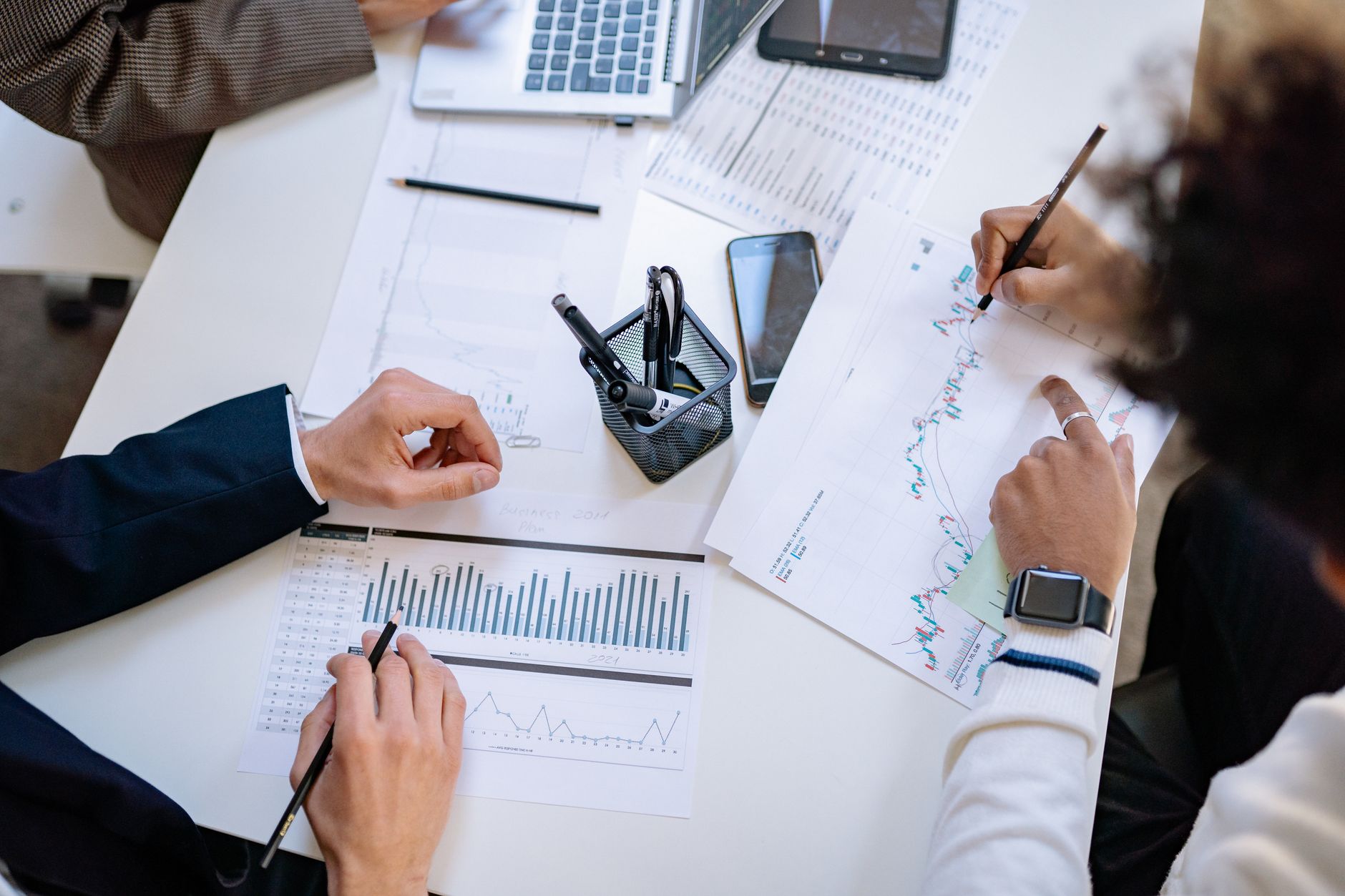 Business team analyzing financial charts and graphs during a collaborative meeting. — The Recovery Time and Care Post-Breast